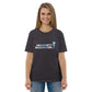 Model wearing the IRACELIKEAGIRL Stanley/Stella Creator unisex tee in Anthracite with the white and sky blue GIRLSGETGRITTY IRACELIKEAGIRL logo on the front