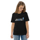 Model wearing the IRACELIKEAGIRL Stanley/Stella Creator unisex tee in Black with the white and sky blue GIRLSGETGRITTY IRACELIKEAGIRL logo on the front