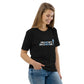 Model wearing the IRACELIKEAGIRL Stanley/Stella Creator unisex tee in Black with the white and sky blue GIRLSGETGRITTY IRACELIKEAGIRL logo on the front
