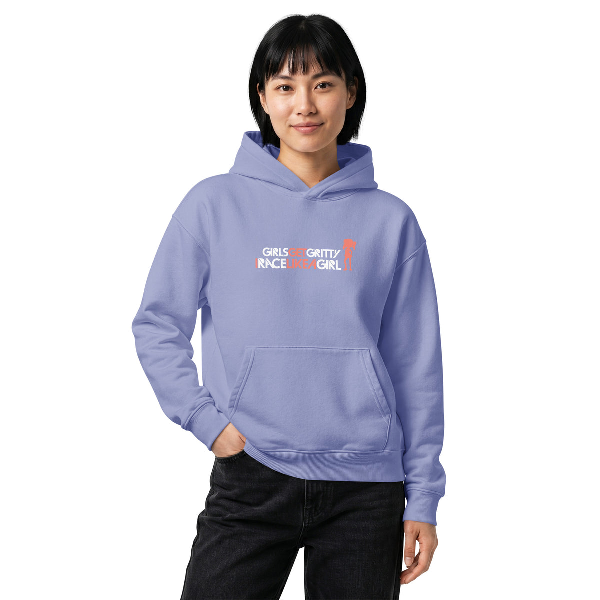 Model wearing the IRACELIKEAGIRL Stanley/Stella Chaser relaxed fit hoodie in Violet with the white and coral GIRLSGETGRITTY IRACELIKEAGIRL logo on the front